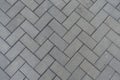 Background - grey concrete pavement with herringbone layout Royalty Free Stock Photo
