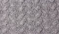 Background of grey knitted fabric. Home made stitchwork. Royalty Free Stock Photo
