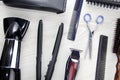 Background of hair cutting tools. Full frame of professional hair styling tools on a wooden background Royalty Free Stock Photo