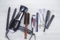 Background of hair cutting tools. Full frame of professional hair styling tools on a wooden background Royalty Free Stock Photo