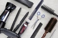 Background of hair cutting tools. Full frame of professional hair styling tools on a wooden background Royalty Free Stock Photo