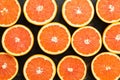 Background of halves of orange. Juicy orange is cut in half.