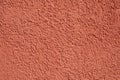 Background of harmonic bright red plaster wall with structure Royalty Free Stock Photo