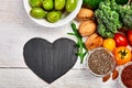 Selection food of rich in antioxidants and vitamins and mineral sources, on white wooden background around cutting board. Healthy Royalty Free Stock Photo