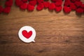 Background with heart on brown wooden floor, blank space for greeting message. Use in Valentine`s Day background concept Royalty Free Stock Photo