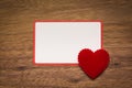 Background with heart on brown wooden floor, blank space for greeting message. Use in Valentine`s Day background concept Royalty Free Stock Photo