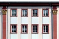 background of historic white facade with windows in row, symbol for historic architecture Royalty Free Stock Photo