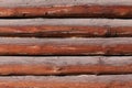 Background of horizontal hewed smooth painted wooden logs close up horizontal view Royalty Free Stock Photo