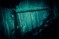 Background horror, scary, darkness. A ghostly gloomy door and a fence, a black wooden gate with a lock, the entrance to the