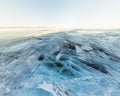 Background ice blue crystal clear lake covered with cracks