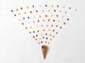 Background with ice cream cone with many colorful jelly beans on white background Royalty Free Stock Photo