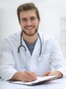 Background image of a doctor writing out a prescription Royalty Free Stock Photo