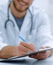 background image of a doctor writing out a prescription Royalty Free Stock Photo