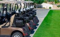 Background image of Golf carts parked on a golf closure in a line Royalty Free Stock Photo