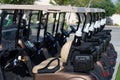 Background image of Golf carts parked on a golf closure in a line Royalty Free Stock Photo