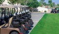 Background image of Golf carts parked on a golf closure in a line Royalty Free Stock Photo