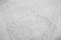 White lace on beige background. Royalty Free Stock Photo