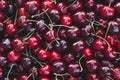 Background image of lying red ripe sweet cherries. Top view, flat lay. Copy space Royalty Free Stock Photo