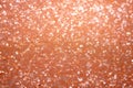 Background image of peach-colored sequins