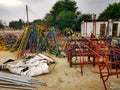 Background image of pile of steel bars dumb in a open ground