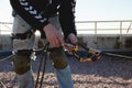 Background image of the process of work on a high-rise building. unset light on metal climbing gear Royalty Free Stock Photo