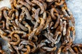 Background image of a rusty pile of chain.