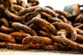 Background image of a rusty pile of chain.