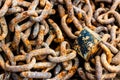 Background image of a rusty pile of chain.