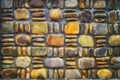 Background image of a stone wall of multicolored rounded stones