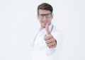 Background image.successful doctor diagnostician showing thumb up