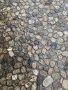 Background image of a wet pavement of small pebbles. Texture background