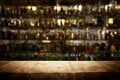background Image of wooden table in front of abstract blurred restaurant lights Royalty Free Stock Photo