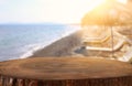 Background Image of wooden table in front of tropical beach. Ready for product display