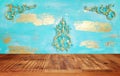 Background Image of wooden vintage table in front of decorative oriental wall. ready for product display