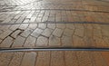 nterwoven tram tracks on historic stone block pavement in a metropolitan setting without people Royalty Free Stock Photo