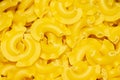 Background of italian pasta, yellow macarons