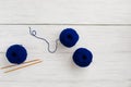 Background with knitting tools and classical blue skein yarn for starting a project Royalty Free Stock Photo