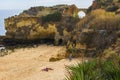 Background landscape view of an arched bridge between rocks on one of the beaches of Lagos