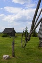 Background landscape view of an old mill, a barn and a field in the museum complex of ancient everyday life Dudutki