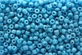 Background of large blue beads in a disfocus  for collage Royalty Free Stock Photo