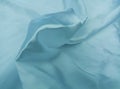 Background of light blue satin fabric surface. Royalty Free Stock Photo