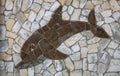 Background of light-colored stone with brown Dolphin.The design of the exterior facade