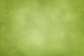 Background of light green suede fabric closeup. Velvet matt texture of olive nubuck textile Royalty Free Stock Photo