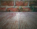 Background of light wooden floor and grungy texture brown brick wall Royalty Free Stock Photo