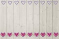 Background of light wooden planks, and flower heart border Royalty Free Stock Photo