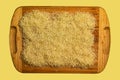 Background of long grain parboiled uncooked rice. Rice groats as background and texture Royalty Free Stock Photo