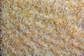 Background of long grain parboiled uncooked rice. Rice groats as background and texture