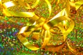 A closeup of golden tangled gift ribbon.