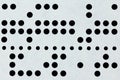 Background macro of perforated punched tape Royalty Free Stock Photo