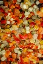 Background made of assorted scattered frozen vegetables. Vertical photo